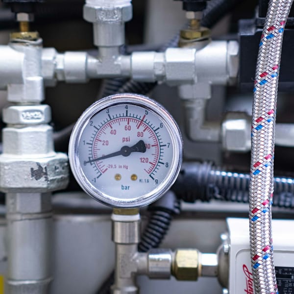 Water pressure gauge in psi on a plumbing manifold